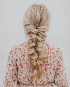Woman with a long fishtail braid